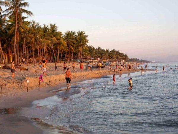 Spend time at Cua Dai Beach